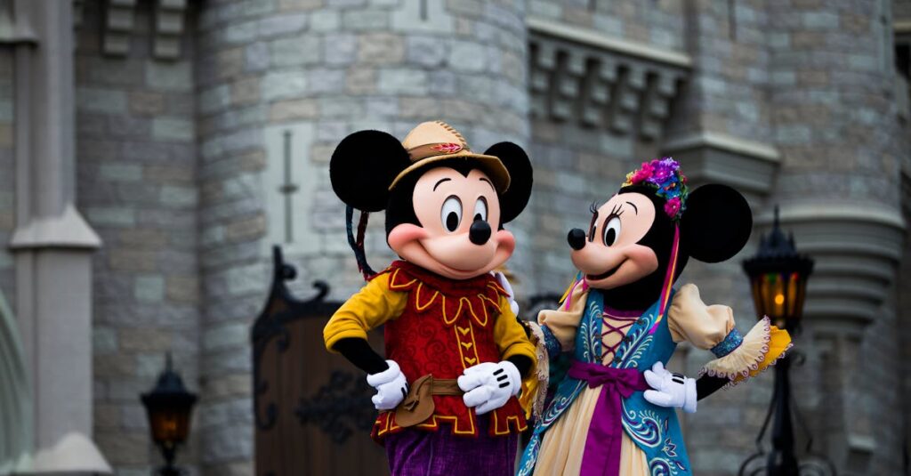 Mickey and Minnie Mouse in colorful costumes outside an iconic castle setting.